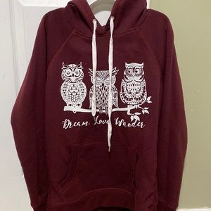 Burgundy hoodie with “Dream Love Wander” and owls design.